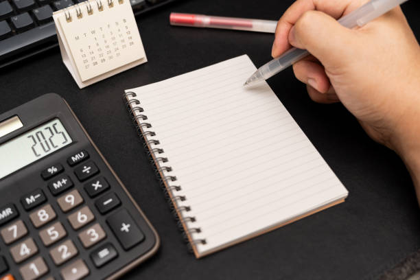 istock Blank Notebook with calculator and office supplies. Copy space for text. Place for an inscription, business concept. 2196299618