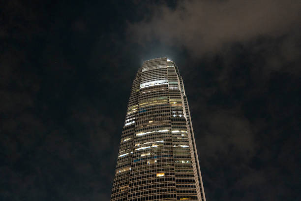 High-rise buildings captured with a perspective showcasing their height and modern architecture in Hong Kong.