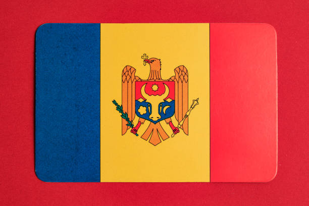 Moldovan flag with national emblem on red background.