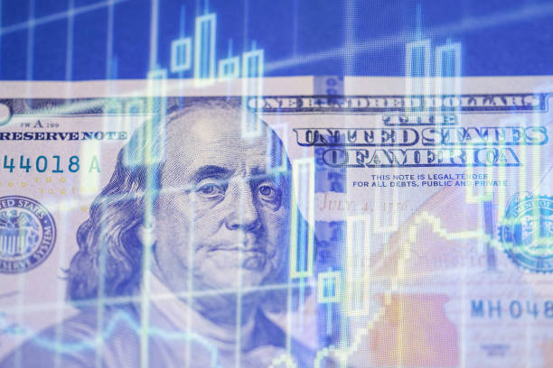 istock Us dollar bill with financial graph overlay representing market trends 2196302652