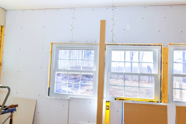 istock New drywall installation in a house renovation project with natural light streaming through windows 2196307677