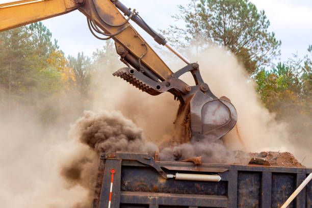 istock An excavator is to process move earth into dump truck at a construction site 2196308448