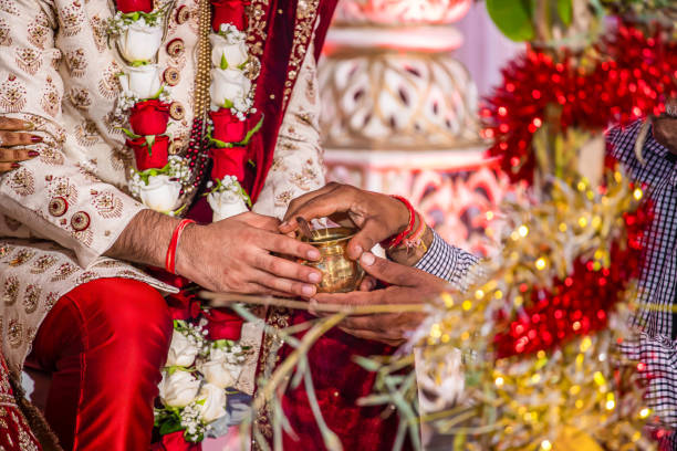 istock Indian Hindu wedding ceremony ritual items hands close up 2196309885