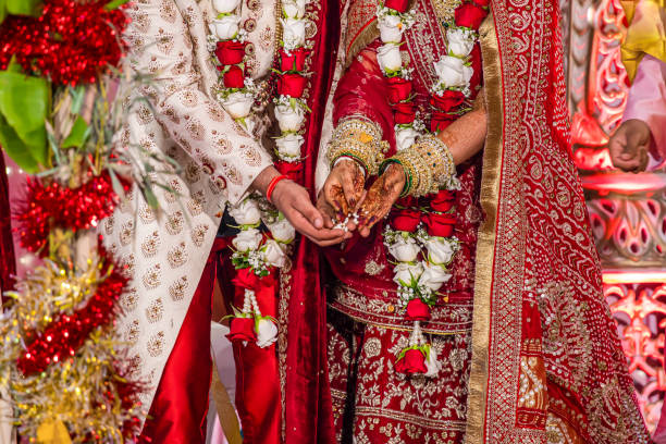 istock Indian Hindu wedding ceremony ritual items hands close up 2196310129