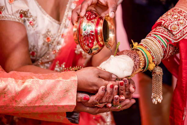 istock Indian Hindu wedding ceremony ritual items hands close up 2196310380