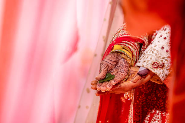 istock Indian Hindu wedding ceremony ritual items hands close up 2196310576