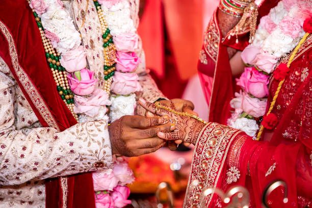 istock Indian Hindu wedding ceremony ritual items hands close up 2196310598