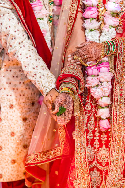 istock Indian Hindu wedding ceremony ritual items hands close up 2196310658