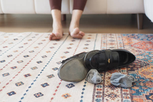 istock dirty sock and shoe on floor 2196311081