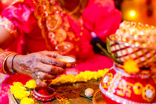 istock Indian Hindu wedding ceremony ritual items hands close up 2196311092