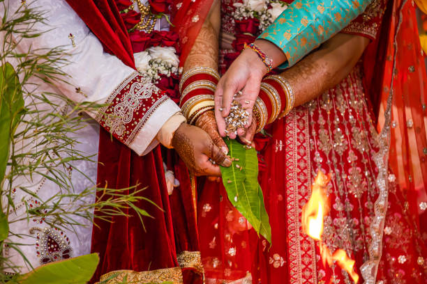 istock Indian Hindu wedding ceremony ritual items hands close up 2196311686