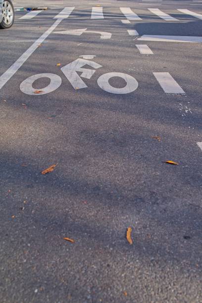 istock Faded Bicycle Lane Marking on Urban Street 2196311806