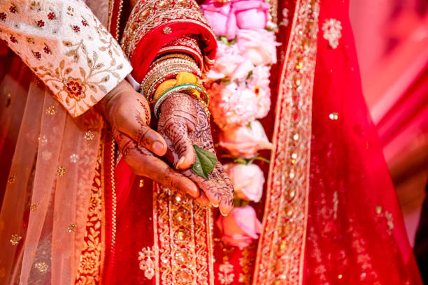 istock Indian Hindu wedding ceremony ritual items hands close up 2196311820