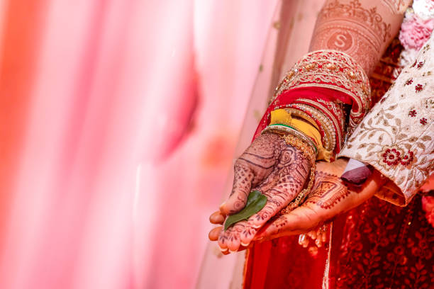 istock Indian Hindu wedding ceremony ritual items hands close up 2196312071
