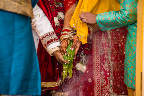 istock Indian Hindu wedding ceremony ritual items hands close up 2196312266