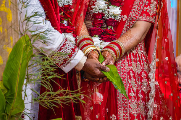 istock Indian Hindu wedding ceremony ritual items hands close up 2196312345
