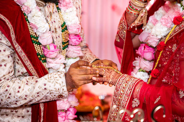 istock Indian Hindu wedding ceremony ritual items hands close up 2196312346