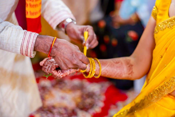 istock Indian Hindu wedding ceremony ritual items hands close up 2196312934