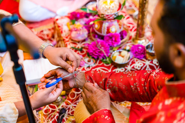 istock Indian Hindu wedding ceremony ritual items hands close up 2196313052