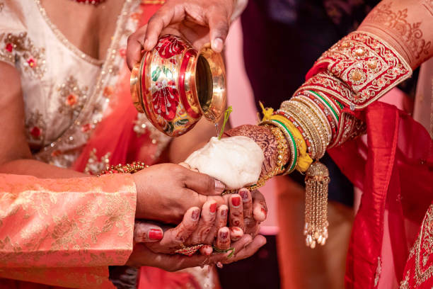 istock Indian Hindu wedding ceremony ritual items hands close up 2196313277