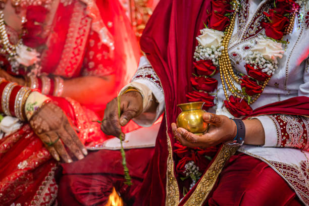 istock Indian Hindu wedding ceremony ritual items hands close up 2196313341