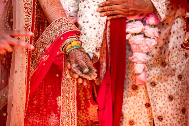 istock Indian Hindu wedding ceremony ritual items hands close up 2196313566