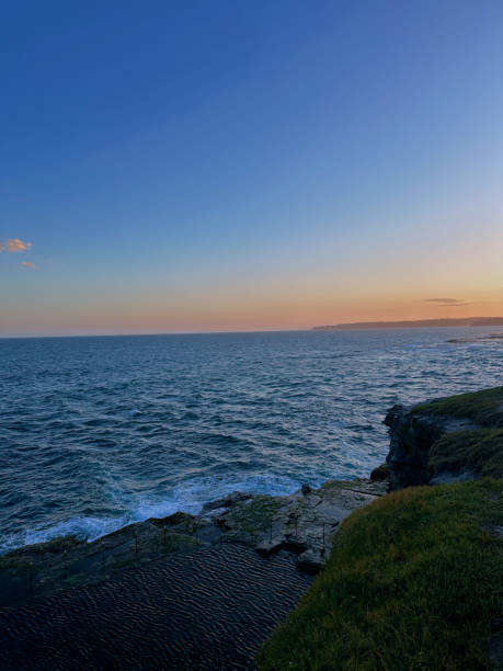 Amanzimtoti beach, south of Durban city in Kwazulu-Natal, showing the tidal pool, a scenic seascape at early sunrise.