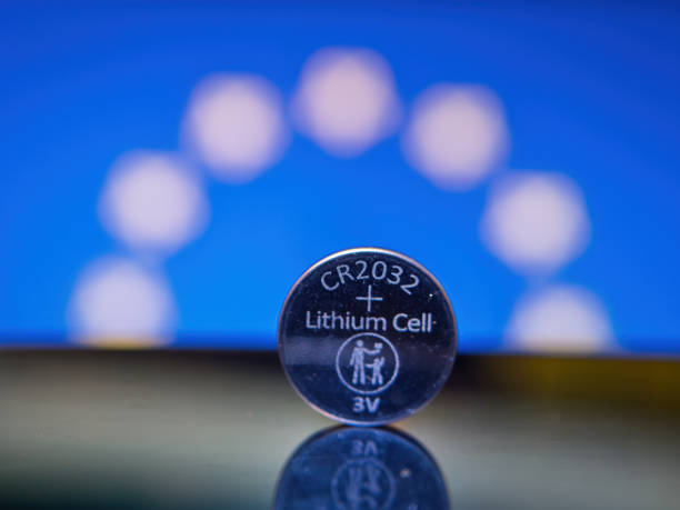 CR2032 Lithium Battery Close-Up with Blue Background