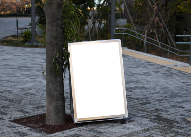 Close-up of blank bulletin board in public park.