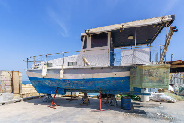 Jaffa, Israel - May 10, 2024: View of shipyard and fishing boats in the historic port of Jaffa, now part of Tel-Aviv-Yafo, Israel