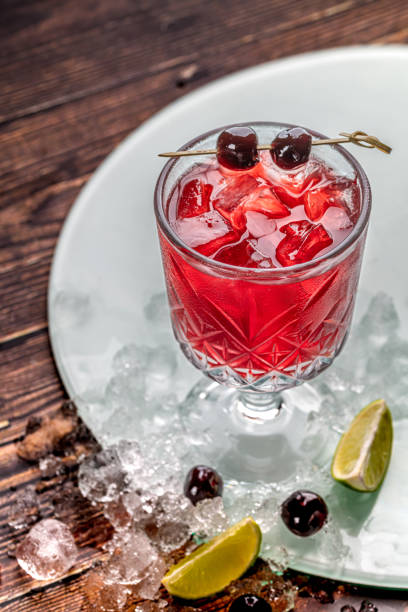 istock Luxury cherry cocktail in crystal glass on wooden table 2196324664