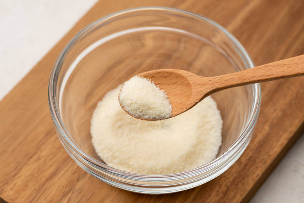 istock Scooping Powdered Gelatin with Wooden Spoon 2196327619