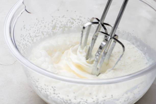 istock Whipping Heavy Cream with a Hand Mixer 2196327768