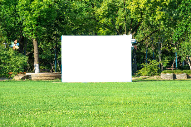 Blank advertising billboard in green park lawn