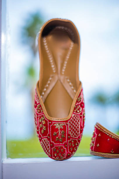 istock Indian bride's wedding shoes close up 2196328889