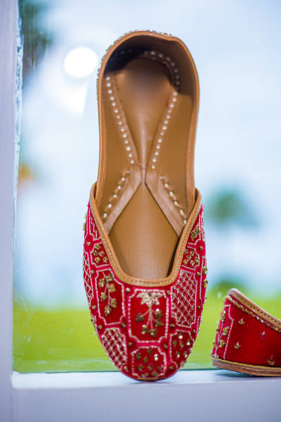 istock Indian bride's wedding shoes close up 2196328900