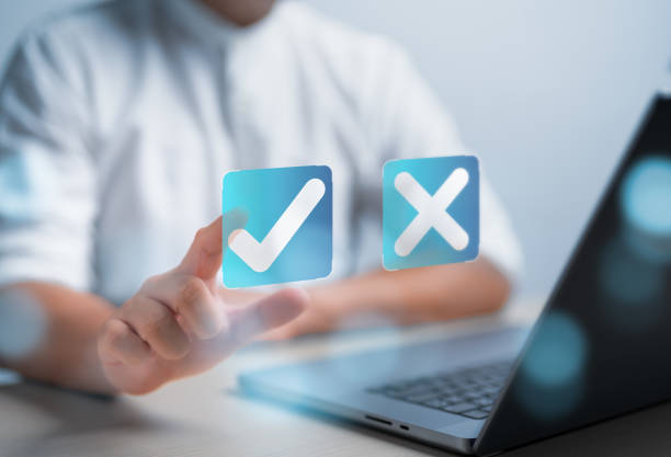 istock Think and make choices between right and wrong symbols. Vote yes or No decisions, business options in difficult situations, crisis decision making. Open-mindedness, public hearing, elections concept. 2196331401