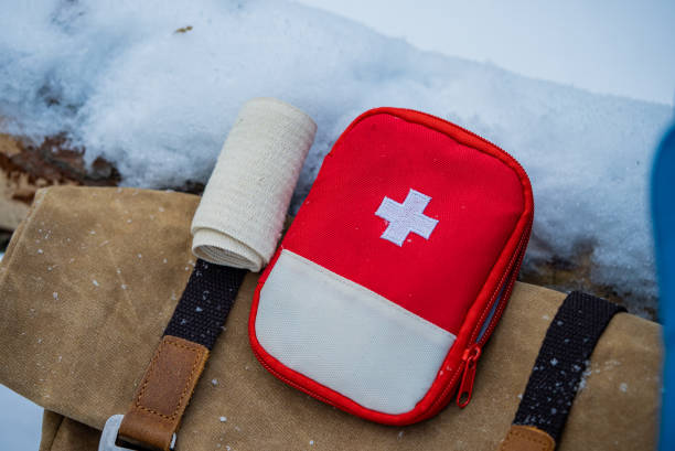 istock First aid kit and bandage lying on backpack in snowy landscape 2196333310
