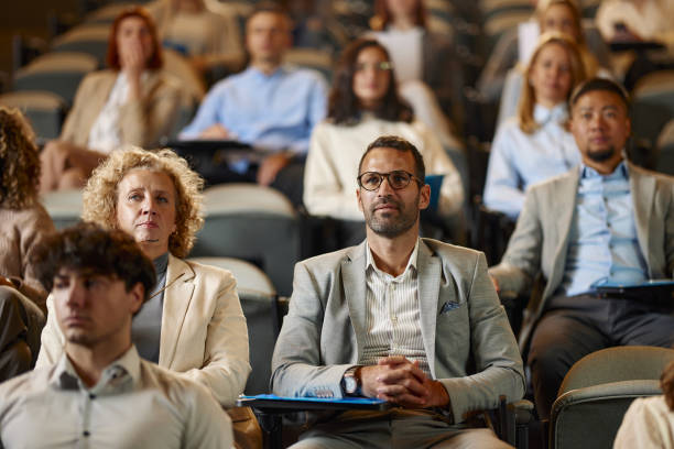 istock Business people attending an education event in convention center. 2196334115