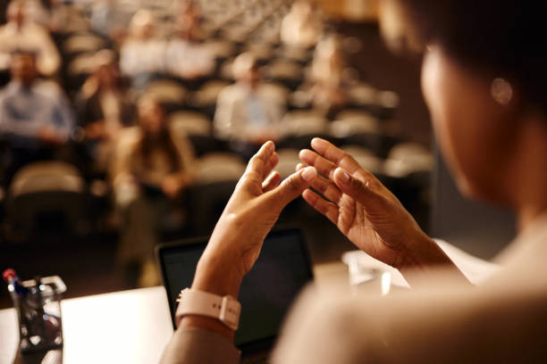 istock Close up of a black public speaker talking on education event. 2196334789