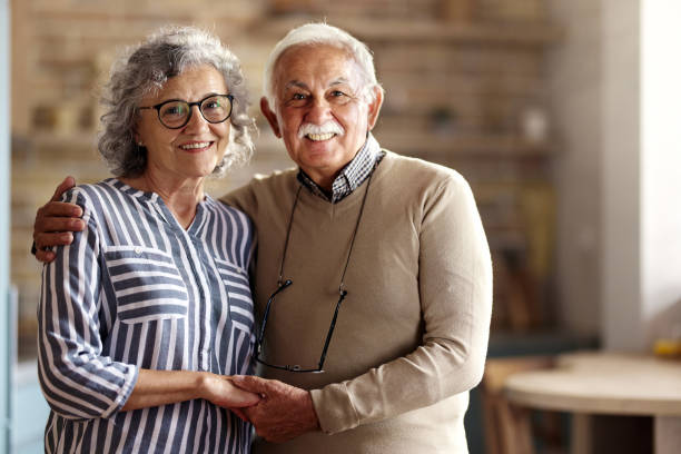 istock Happy embraced senior couple enjoying at home. 2196335396