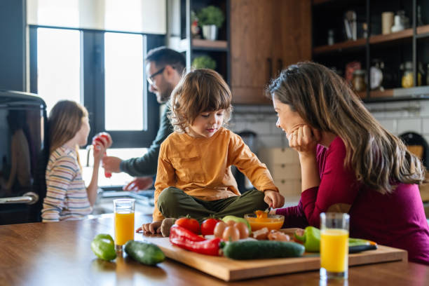 istock Happy family having fun in the kitchen, spending quality time together during weekend. 2196337123