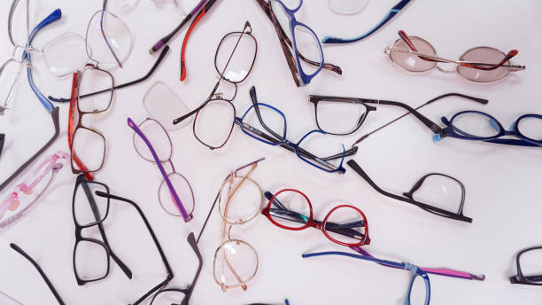 istock Assortment of broken optical eyeglasses, broken hinges, missing lenses 2196338054