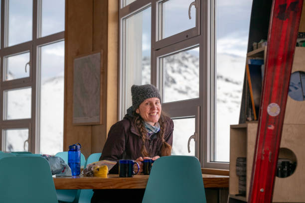 istock Backcountry skier relaxes in ski lodge 2196339830