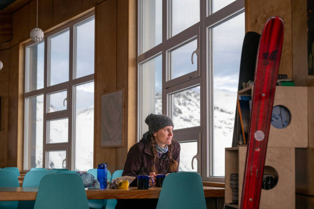 istock Backcountry skier relaxes in ski lodge 2196339844