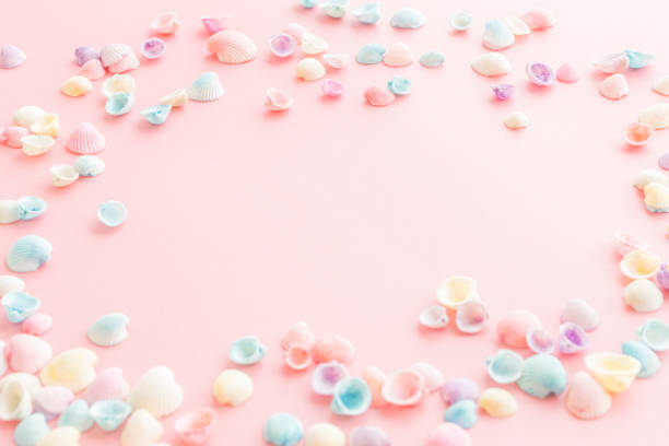 istock Pastel colored seashells on a pink background. Cute summer background. 2196341648