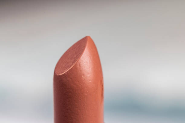 lipstick on a blue background, details of a new open lipstick for makeup