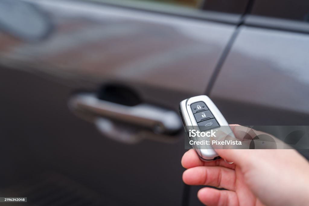 Remote Vehicle Unlocking Hand Holding Car Key Remote Control Unlocking Vehicle Stock Photo ...