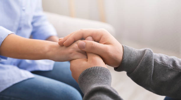 istock Psychologist consoling his patient, making supporting gesture 2196342269