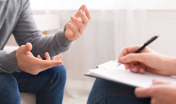 istock Psychotherapist writing notes, assessing patient's health and giving diagnosis 2196342276